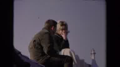 Los Angeles California USA (1967): A Young Couple Sitting At The Top Of The