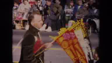 Los Angeles California USA (1967): Man Holding Parade Flags And Mickey Mouse Style
