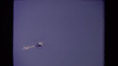 Los Angeles California USA (1967): A Lone Helicopter Flies Across The Large Blue