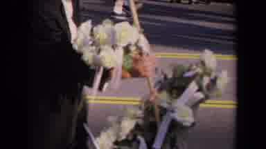 Los Angeles California USA (1967): View Of White Roses And Man Walking With Two