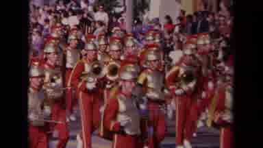 Los Angeles California USA (1967): Colorful Band Wearing Trojan Hats March In A