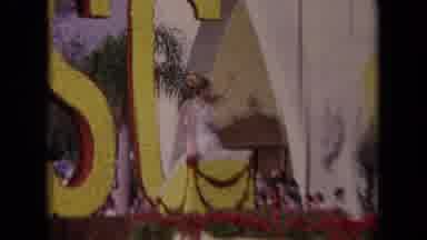 Los Angeles California USA (1967): Woman And Man Riding Through A Parade With A