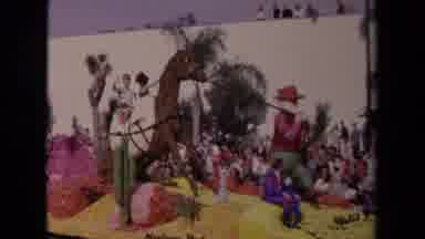 Los Angeles California USA (1967): Parade With People Riding On Floats Past White