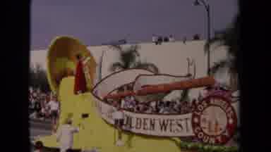 Los Angeles California USA (1967): A Colorful Car In A Parade Being Admired By
