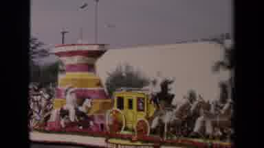 Los Angeles California USA (1967): Crowds Watch Pink White And Yellow Parade Float