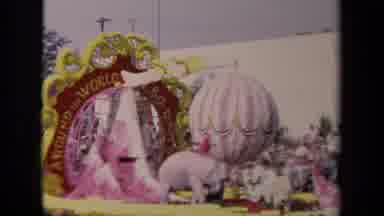 Los Angeles California USA (1967): Man And Woman Ride Parade Float Next To An