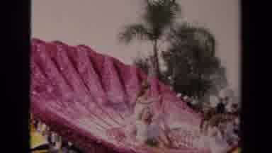 Los Angeles California USA (1967): Woman Sitting On Pink Shell Parade Float Waving