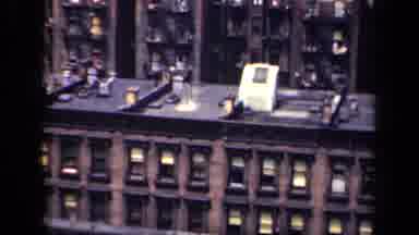 New York USA (1941): Crowded City Streets Below The Industrial Looking Roofs Of