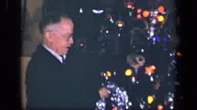 Sebring Ohio USA (1942): Elderly Man Using Tinsel To Decorate A Lighted Christmas