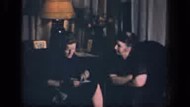 Sebring Ohio USA (1942): Man And Woman Talk In A Darkly Lit Room As The Camera