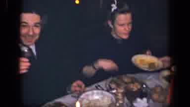 Sebring Ohio USA (1942): People At Dinner Passing Around Food With Red Lit Candles