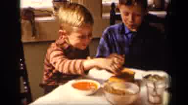 Sebring Ohio USA (1942): Two Brothers Are Having Fun While Sharing A Snack At The