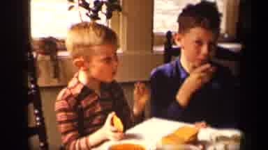 Sebring Ohio USA (1942): A Family Happily Eating A Meal Together At A Kitchen