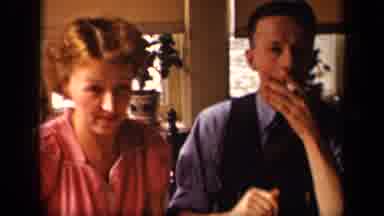 Sebring Ohio USA (1942): Man In Vest Smoking A Cigarette As Woman Stands Closely