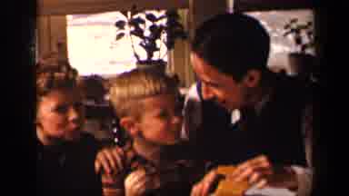 Sebring Ohio USA (1942): A Man And Two Boys Smiling And Talking While They Eat