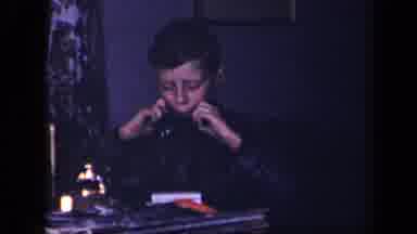 Sebring Ohio USA (1942): Young Man Sitting At A Table Concentrating As He Plays A