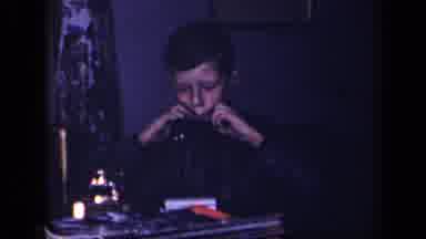 Sebring Ohio USA (1942): Kid Soberly Playing What Looks To Be A Harmonica