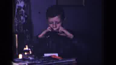 Sebring Ohio USA (1942): A Child Sitting With Something In His Mouth That He Is