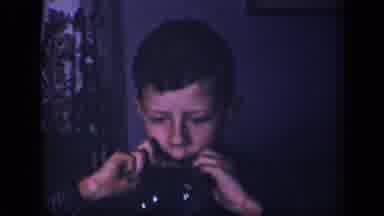 Sebring Ohio USA (1942): Child Playing The Harmonica
