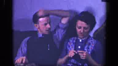 Sebring Ohio USA (1942): Mom Knotting While Sitting On Couch Next To Boy Than