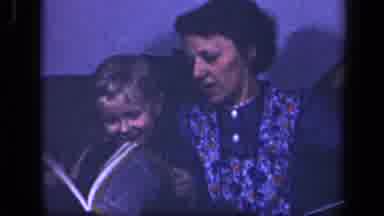 Sebring Ohio USA (1942): Woman With A Child In Her Lap Looking At National