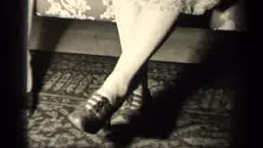 Sebring Ohio USA (1942): Pan Up View Of Legs Wearing Shoes And A Dress