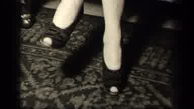 Sebring Ohio USA (1942): A Lady Wearing A Dress And High Heels Sitting In A Chair