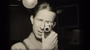 Sebring Ohio USA (1942): White Man Filming And Talking In Black And White Image
