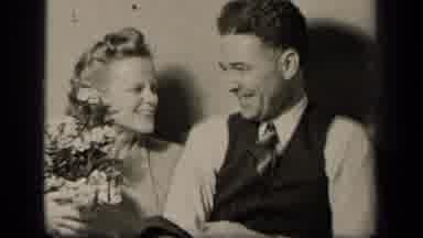 Sebring Ohio USA (1942): Talking Laughing Happy Man And Woman Holding Flowers