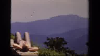 Skyline Drive Virginia USA (1943): People Lay Out Under The Sun Along A Stone Wall