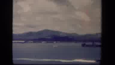 Leyte Gulf Philippines (1944): View Of Surf And Mountain On A Cloudy Day