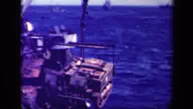 Leyte Gulf Philippines (1944): A Large Crane Moves A Huge Box To The Dock To