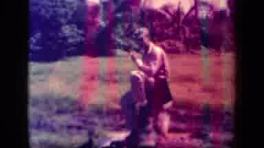 Leyte Gulf Philippines (1944): Person Sits On A Log And Smokes While The Camera