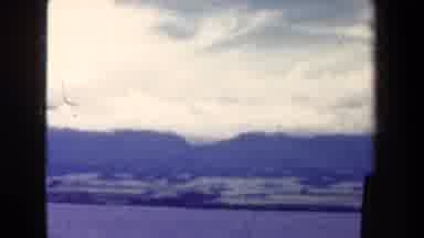 Papua New Guinea (1944): The Horizon Of A Bright Blue Sky With White Clouds