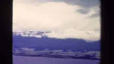 Papua New Guinea (1944): A Beautiful Mountain Range Barely Visible Beneath The