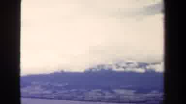 Papua New Guinea (1944): Clouds Over Mountains With Ocean Below Tropical Scene