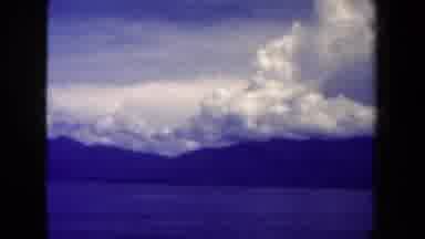 Papua New Guinea (1944): The Sky Over The Mountain Top With The Clouds Floating