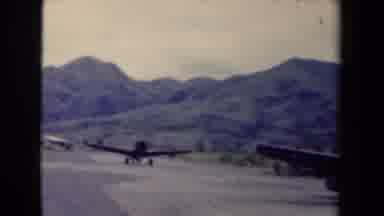 Papua New Guinea (1944): Two Airplanes Taxi Down The Runway On Their Way From The