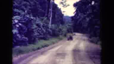 Papua New Guinea (1944): Old Dirt Road Cars Trucks