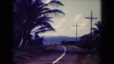 Kauai Hawaii USA (1944): Long Road With Mountains In The Distance And Tropical