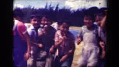 Kauai Hawaii USA (1944): Young Asian Children Standing In Order To Get A Group