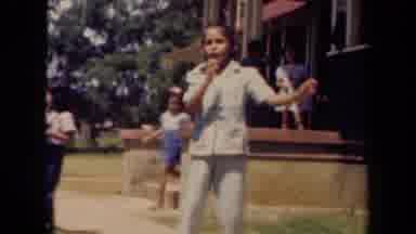 Kauai Hawaii USA (1944): A Child Dancing Outside With Other Children In The