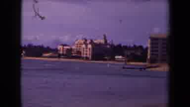 Kauai Hawaii USA (1944): An Image Of An Empty Beach With Big Buildings In The