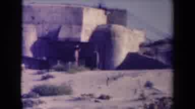 France (1945): People Walking By Huge White Container On A Bright Sunny Day