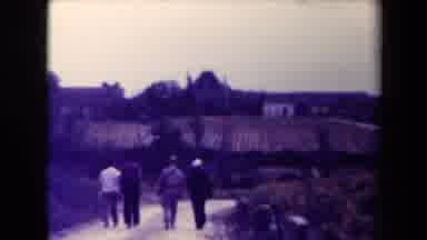 France (1945): Four Gentlemen Walking Down Dirt Road