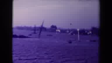 France (1945): Picture Captures View Of Large Graves At River Or Ocean Or Sea