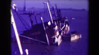 France (1945): Wreckage Large Ships And Smaller Boats Around Them After Having