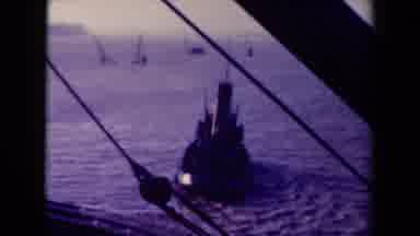 France (1945): Man Wearing Jacket Hat And Gloves Stands On A Watercraft's Helm