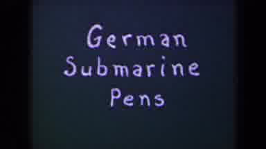 France (1945): German Submarine Pens Followed By Long Distance View Of A Body Of