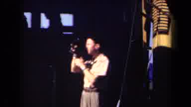 NETHERLANDS-1946: Man Filming with Camera in Dimly Lit Room
